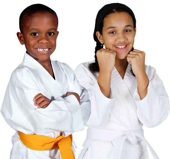 A boy and girl, both children, wearing white karate uniforms with white and yellow belts, striking a karate pose